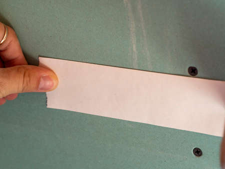 a special corrugated tape is applied to the seam in the drywall.