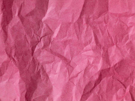 The texture of crumpled paper is maroon. top viewの写真素材