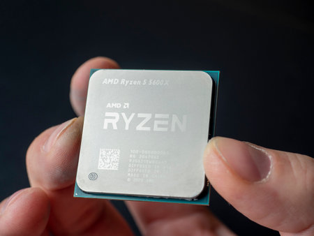 3.01.2021 Moscow. New generation Zen 3 AMD Ryzen 5600X computer processor in hand close-up.のeditorial素材