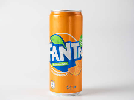 Aluminum can with sweet carbonated drink Fanta isolated on a white background, made for Russia....