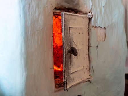 Close-up of the slightly open door of an old Russian ovenのeditorial素材
