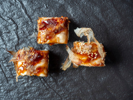 Close-up of delicious rolls laid out on textured black dishes. Top view, flat lay. Japanese cuisineのeditorial素材