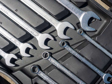 Close-up of a set of repair wrenches in a box. A set of tools. Top view, flat lay