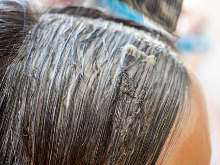 close-up of the hair on which the paint is applied. Hair coloring. selective focusの写真素材
