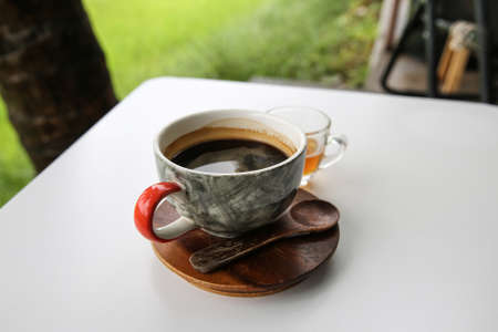 Hot coffee in cup, Hot amaricano among cornfield
