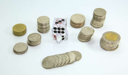 coin and dice, Thai gambling, on white backgroundの写真素材