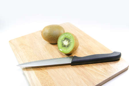 Kiwi fruit and knife on white background.の写真素材