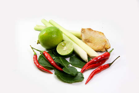 ginger, lemograss, onion, lime leaves, chilli, lemon, Fresh herbs and spices asian ingredients food on block on white background , thai foodの写真素材