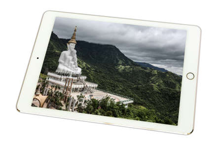 White buddha statue, Wat Phra That Pha Son Kaew, during the rainy season in tablet on white...