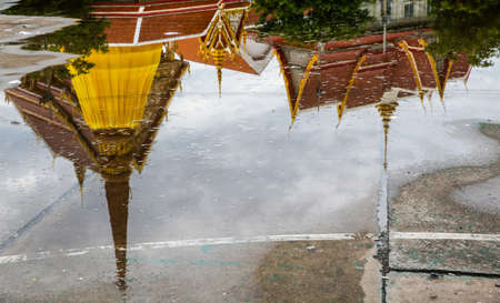 Reflections of Temple with Buddha's relics and pagoda in Wat Thart, Khonkaen, Thailand.の写真素材