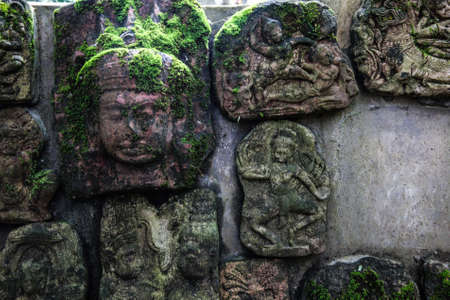 The low relief sculpture idol Abandoned., Khmer art in Thailand., vintage style.の写真素材