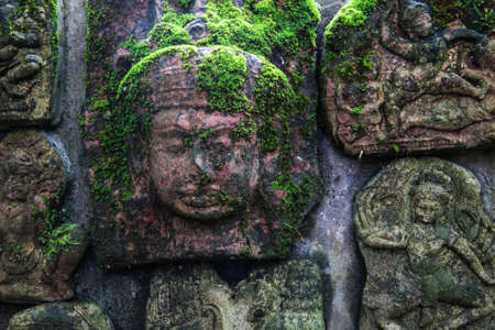 The low relief sculpture idol Abandoned., Khmer art in Thailand., vintage style.