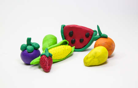 clay mold Mixed Fruit on white background., kid hand.の写真素材