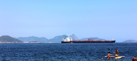 Sea with sunny day and boat in the background.の写真素材