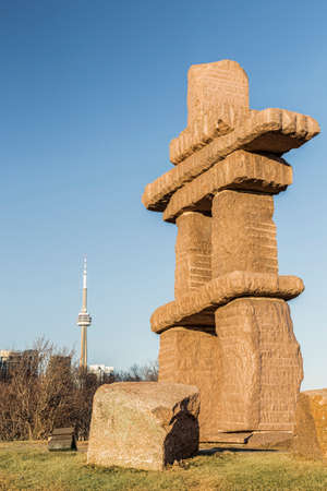 Inuksuk Park in downtown Toronto with the CN Tower in the background.の写真素材
