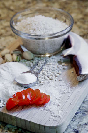 A medley of cooking ingredients on a cutting board.の写真素材