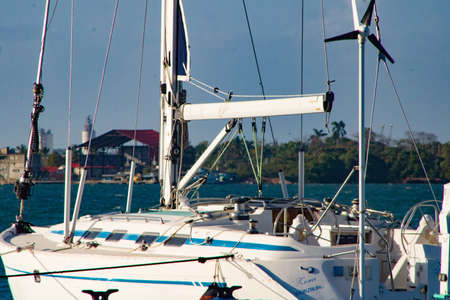 sailboats moored in beautiful beach of the Caribbean Sea with views of a beautiful nautical clubの写真素材