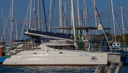 sailboats moored in beautiful beach of the Caribbean Sea with views of a beautiful nautical clubの写真素材