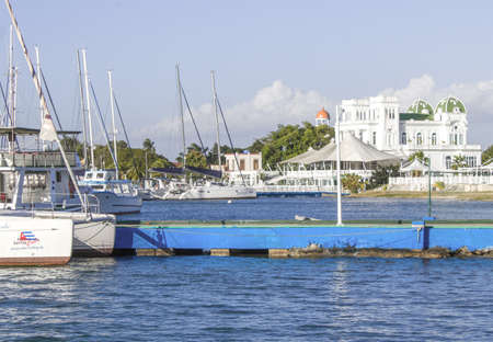 sailboats moored in beautiful beach of the Caribbean Sea with views of a beautiful nautical clubの写真素材