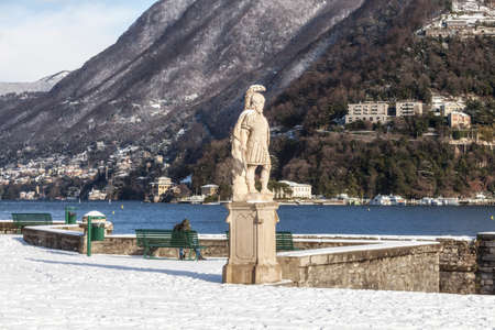 COMO, COMO LAKE - ITALY - January 13, 2017: Park of neoclassical Villa Olmo in Como during the winter. A warrior statue by the lakeのeditorial素材