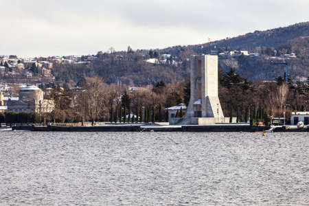 COMO, COMO LAKE - ITALY - January 13, 2017: Panoramic view of Como town  in the winter time with two importants monuments: the Monument to the Fallen and the Volta Templeのeditorial素材
