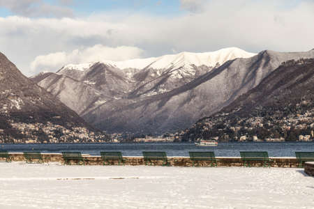 Landscape of Como Lake, Italy.  Picture of the lake to the north with snow-capped mountains. Winter timeの写真素材