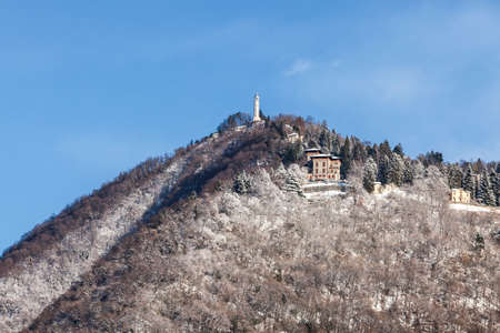 Panoramic view of the mount that overlooks the city of Como. Town of Brunate in winter time. Como lake.の写真素材