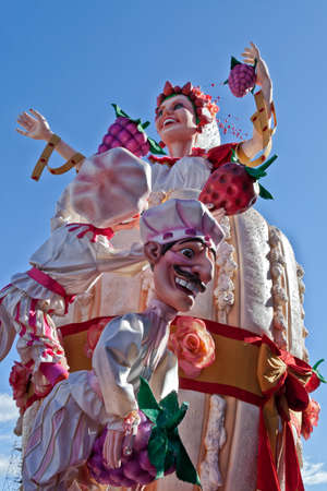 NICE - FRANCE - March 03, 2014: King of carnival 2014. The theme of Nice carnival is the gastronomy. Check a woman from a cake with grapes and strawberriesのeditorial素材