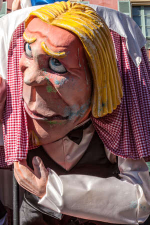 NICE - FRANCE - March 03, 2014: King of carnival 2014. The theme of Nice carnival is the gastronomy. A large mask with blonde hairのeditorial素材