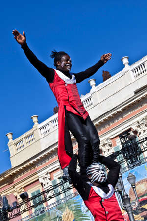 NICE - FRANCE - March 03, 2014: King of carnival 2014. The theme of Nice carnival is the gastronomy. Two acrobatsのeditorial素材