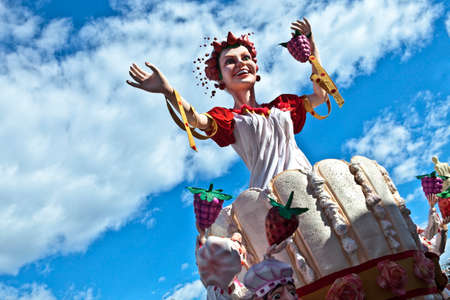 NICE - FRANCE - March 03, 2014: King of carnival 2014. The theme of Nice carnival is the gastronomy. Check a woman from a cake with grapes and strawberriesのeditorial素材