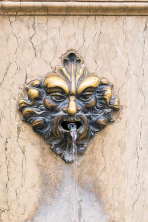 Fountain with Bronze Haed mask in Veniceの写真素材