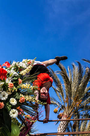 NICE - FRANCE - March 01, 2014: Carnival of Nice, Flowers' battle. A dancerのeditorial素材