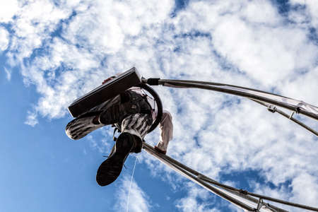 NICE - FRANCE - March 01, 2014: Carnival of Nice, Flowers' battle.  An acrobat in businessman suit walking in the skyのeditorial素材
