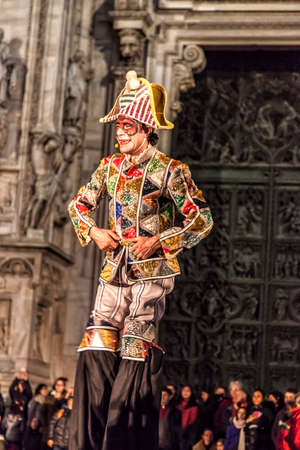 MILAN - ITALY - March 02, 2017: A company of acrobats actors inaugurate the Milan Carnival. In the background the Gothic Cathedral. Duomo square, Milan, Lombardy, Italyのeditorial素材