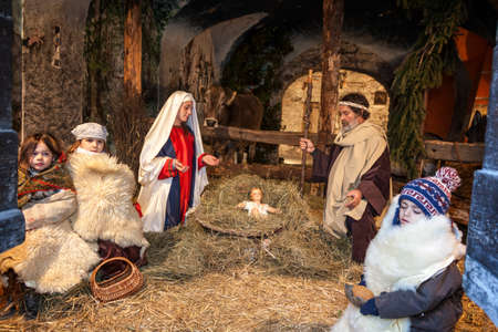 ARGEGNO, COMO LAKE - ITALY - January 01, 2017: Live nativity scene played by local inhabitants. The Holy Family and the shepherdsのeditorial素材