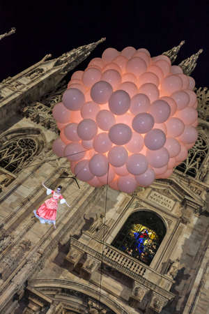 MILAN - ITALY - March 02, 2017: A company of acrobats actors inaugurate the Milan Carnival. In the background the Gothic Cathedral. Duomo square, Milan, Lombardy, Italyのeditorial素材