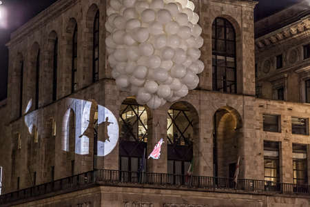 MILAN - ITALY - March 02, 2017: A company of acrobats actors inaugurate the Milan Carnival. In the background the Arengario Palace. Duomo Cathedral square, Milan, Lombardy, Italyのeditorial素材