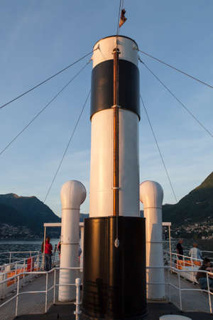 COMO, COMO LAKE - ITALY - May 10, 2015: Funnel on old passenger ship at sunset in Como Lake. Italyのeditorial素材