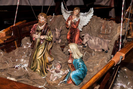 COMO, ITALY - December 10, 2016: Christmas Nativity scene set in a boat

の写真素材