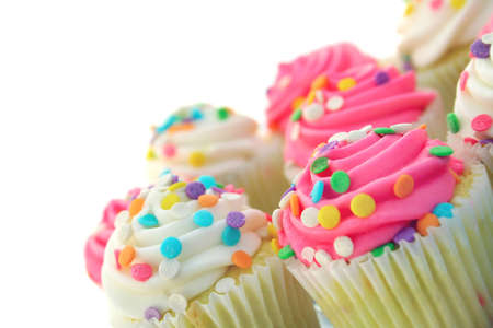
tilted plate of cupcakes on a white background with space for text.