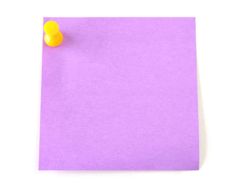 A purple post it with a yellow thumb tack isolated on a white background.の写真素材