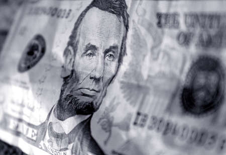 five dollar bill wrinkled and done in a blue tone. Selective focus used.の写真素材