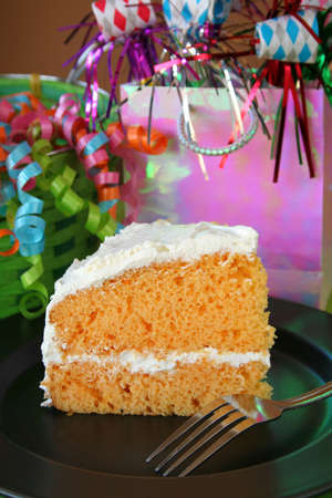 One piece of Birthday cake with white frosting.