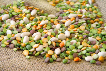 An assortment of beans for bean soup all on a burlap background.の写真素材