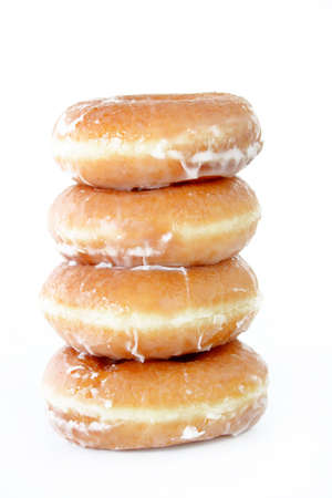 A stack of donuts isolated on a white background.の写真素材