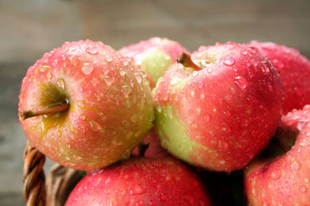 A close up of apples covered with rain drops.の写真素材