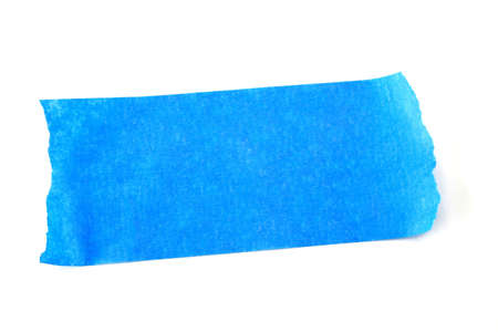 Torn piece of blue tape isolated on a white background.の写真素材