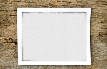 An old photo filled with a texture and put on an old piece of wood.の写真素材