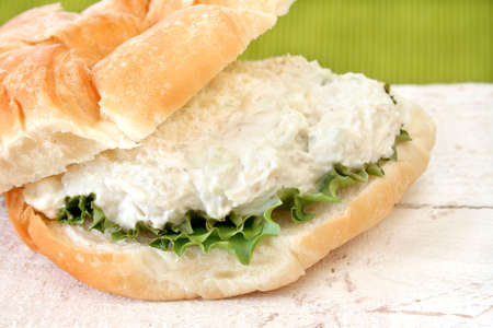 Close up of a chicken salad sandwich on a delicious croissant.の写真素材
